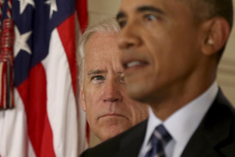 Biden watches Obama speak about the agreement of the Iran nuclear deal in Washington, July 2015